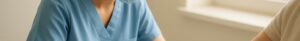 Nurse drawing blood for cholesterol test on patient in bright Colchester clinic
