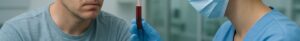 Concerned man with thinning hair receiving blood test for hair loss in Basingstoke clinic.